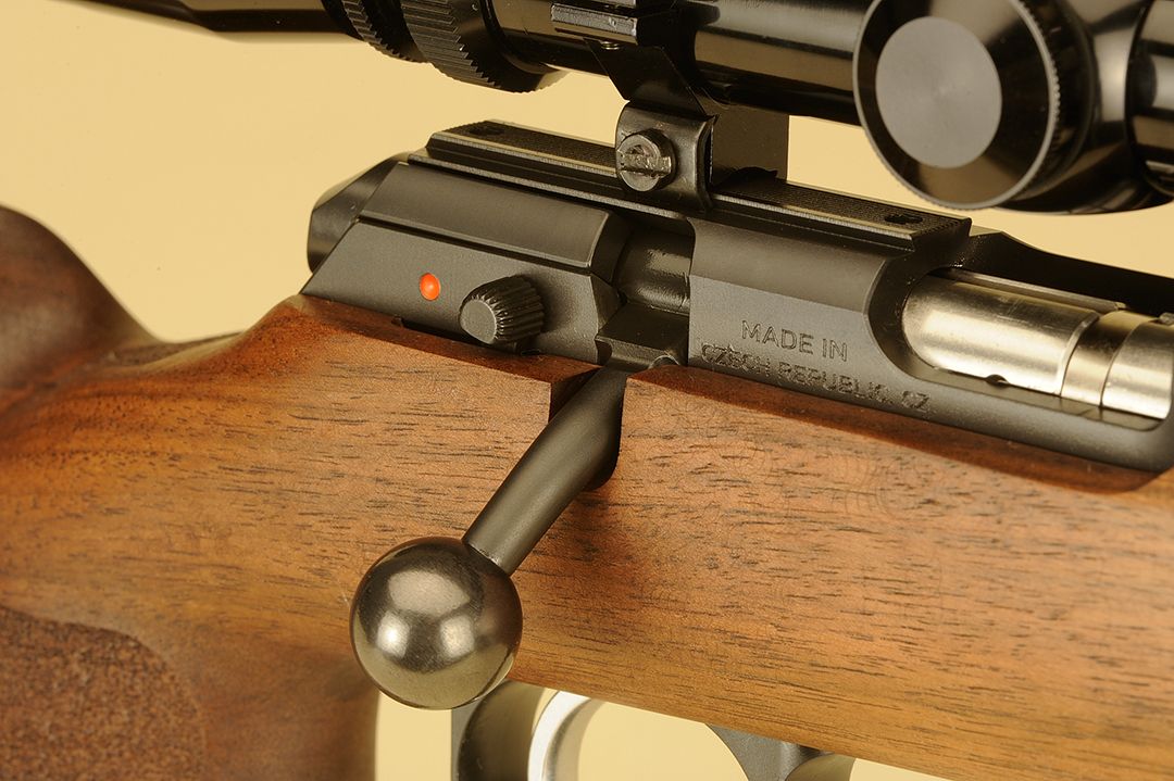 One of the new upgrades is the side-mounted safety as shown here. Two positions, this newer, push-to-fire design, allows the shooter to operate the bolt with the sear locked. The receiver is steel, polished and blued that has been shortened by an inch over previous models.